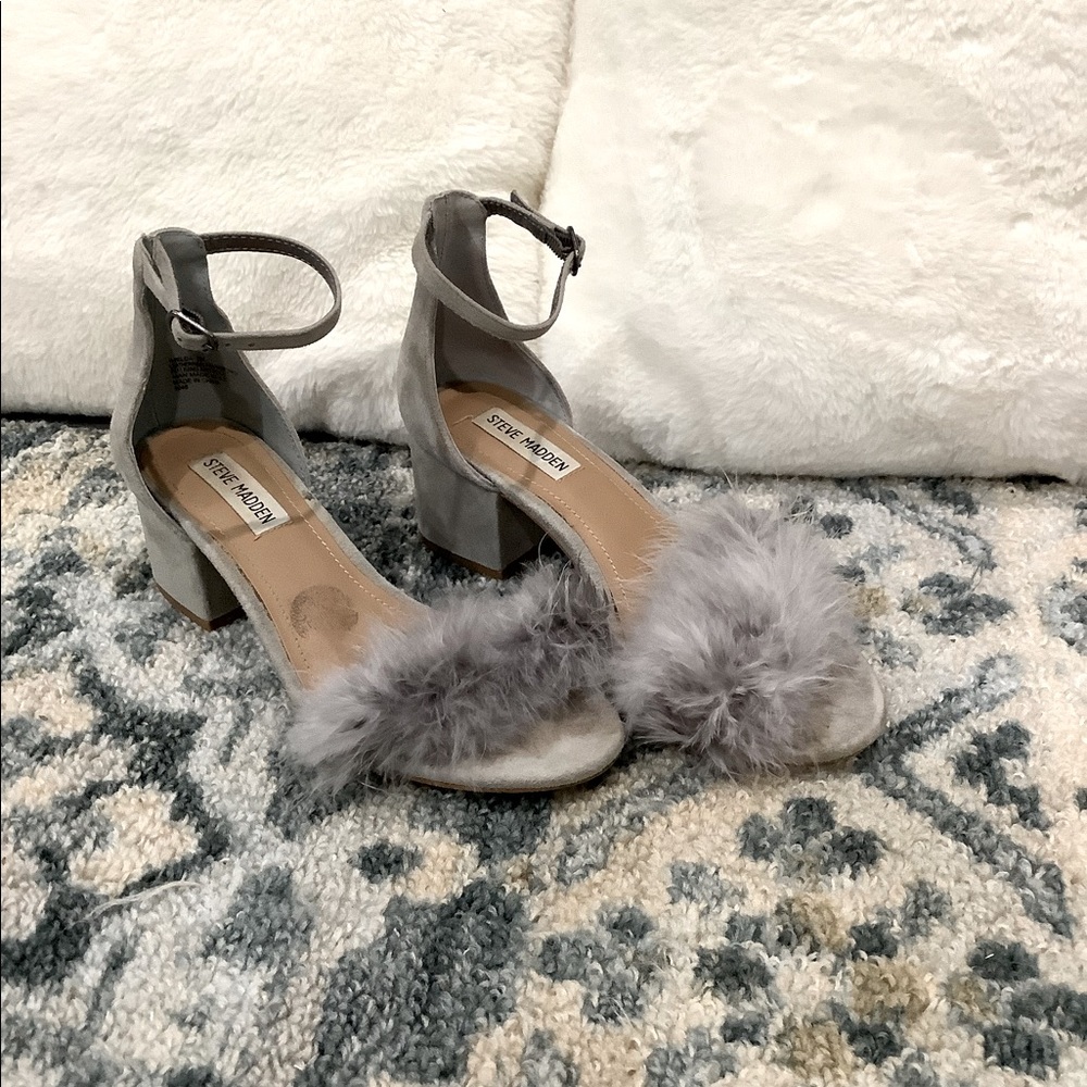 Grey heels with feather straps.